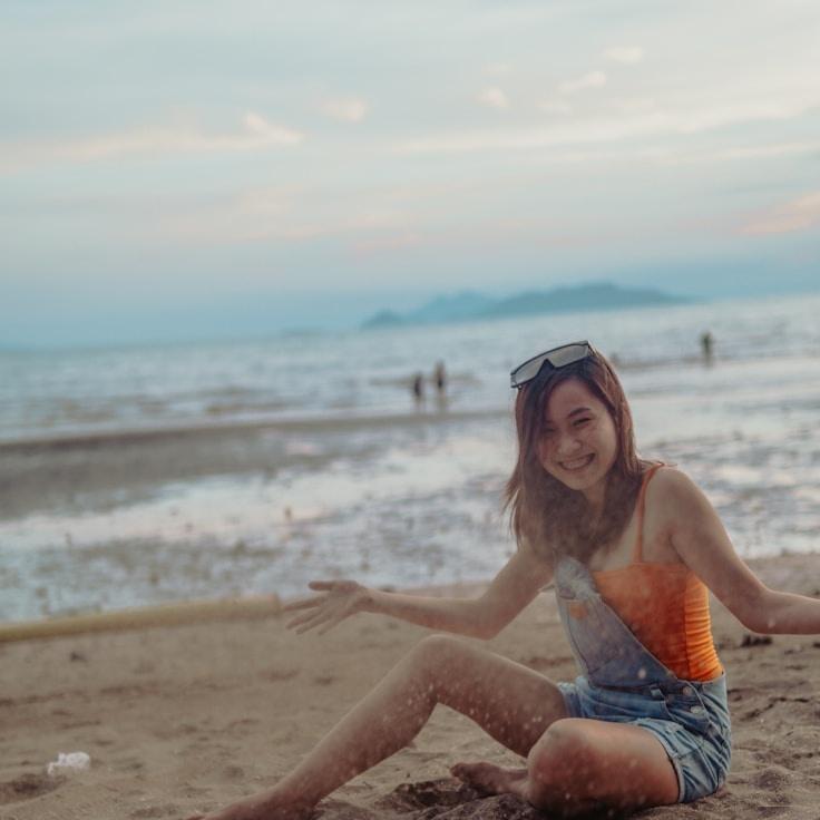 Aria Kapoor, Lead Design Curator at Ever Green Valley Station, reviewing corporate floral arrangements